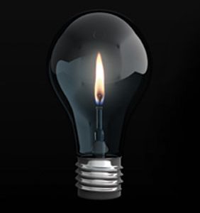 Image of candle inside a lightbulb - blackout