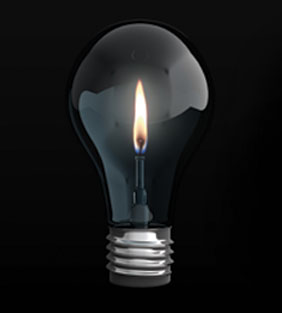 Image of candle inside a lightbulb - blackout